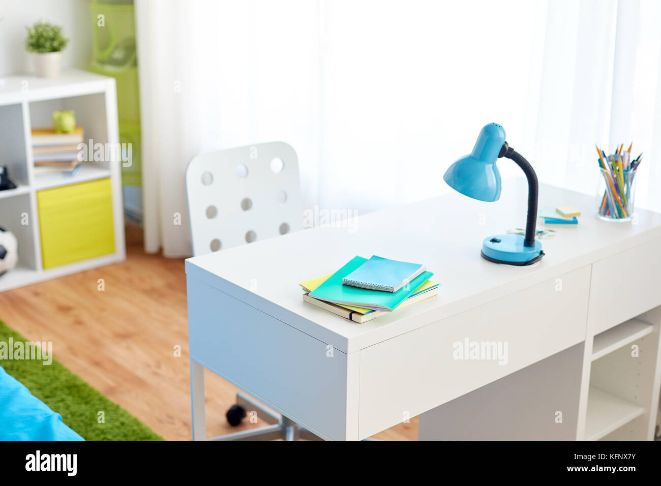 kids room interior with table and school staff Stock Photo