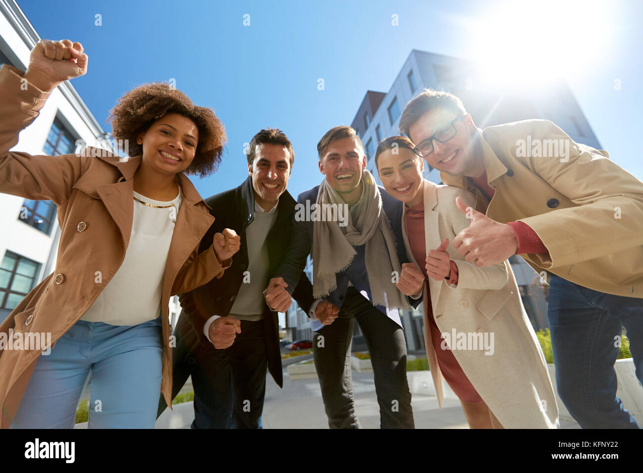 group of people showing thumbs up in city Stock Photo - Alamy