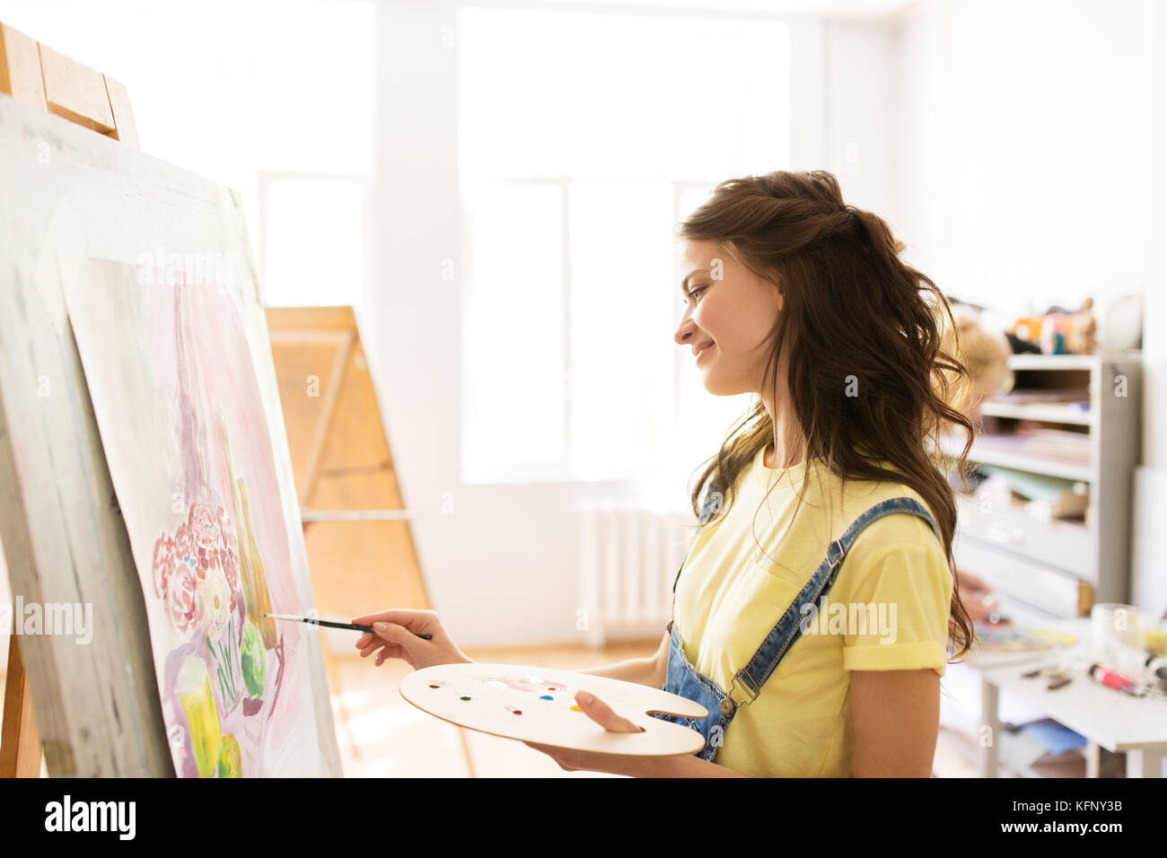 student girl with easel painting at art school Stock Photo - Alamy