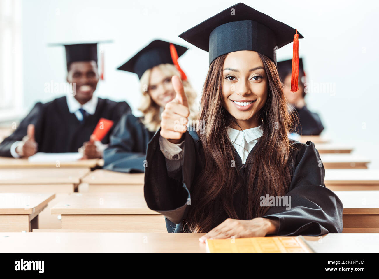 student girl showing thumb up Stock Photo - Alamy