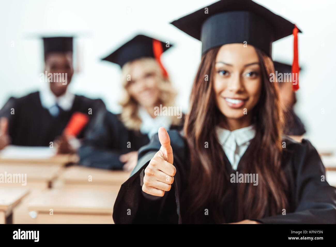 student girl showing thumb up Stock Photo - Alamy