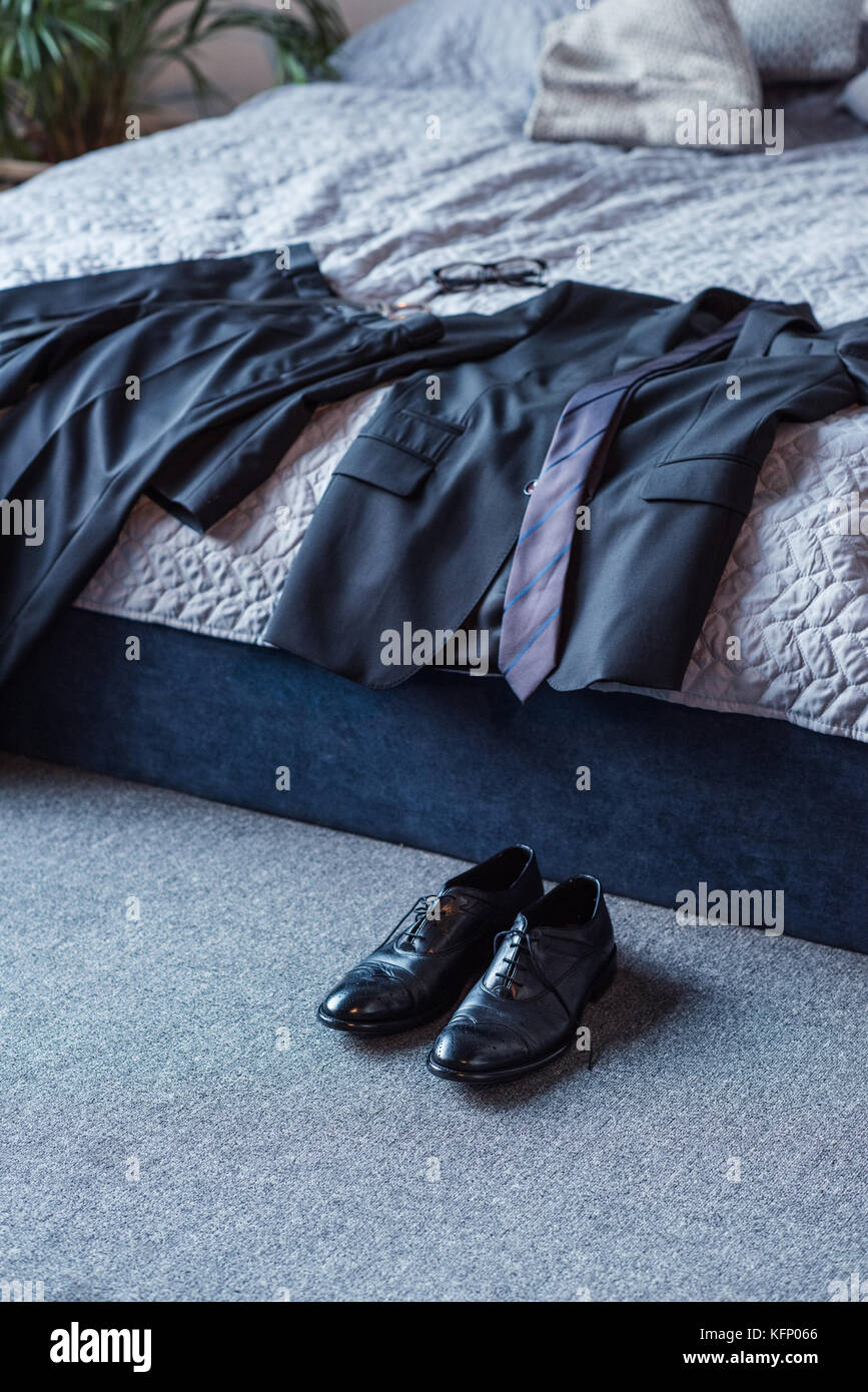 Business suit on bed Stock Photo