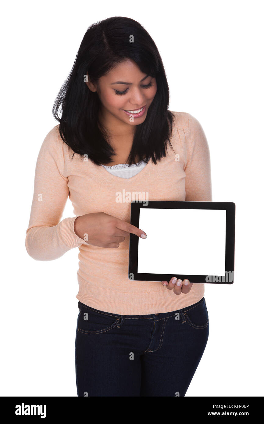 Young Woman Holding Digital Tablet Over White Background Stock Photo ...