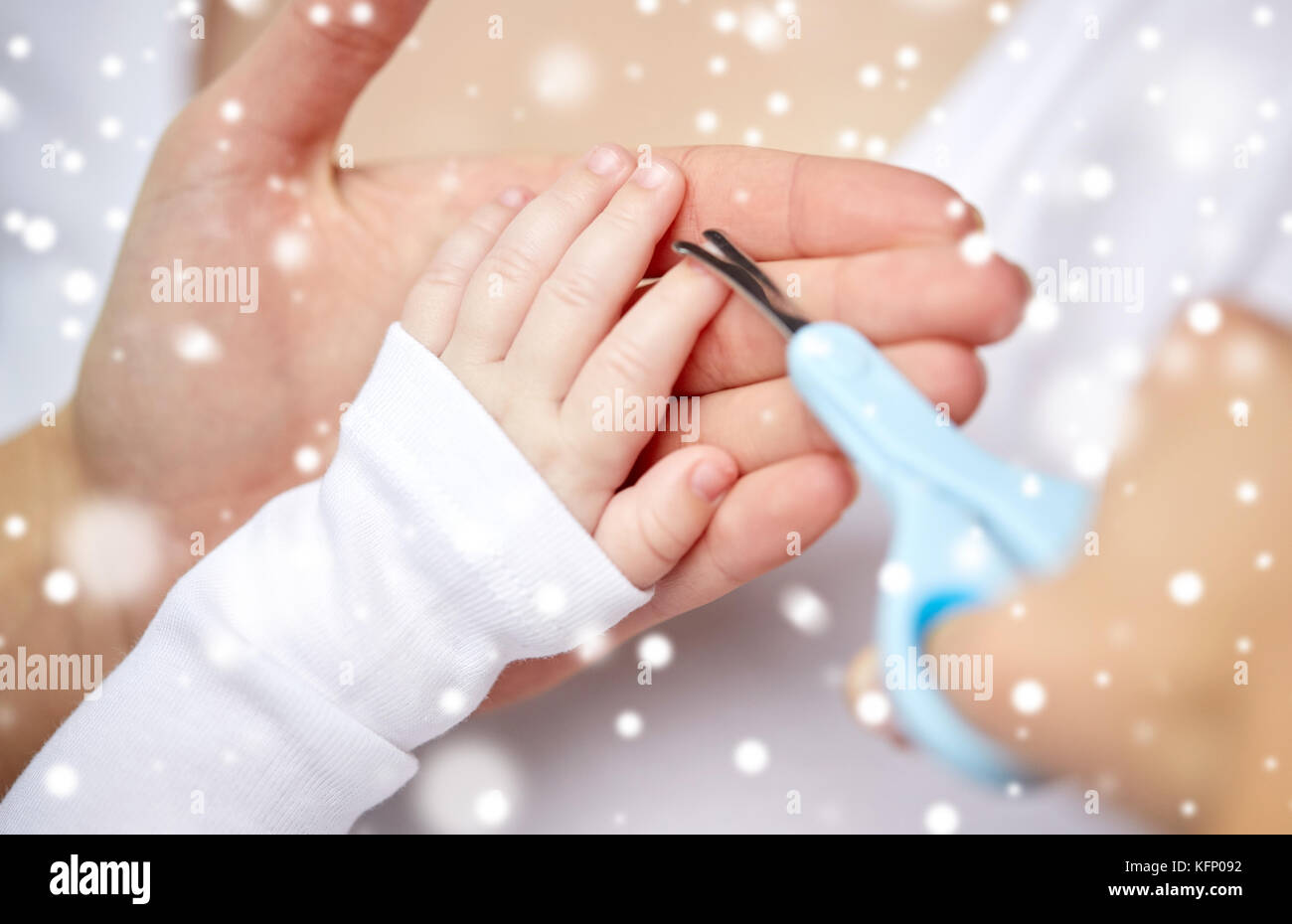 close up of hand with scissors trimming baby nails Stock Photo Alamy
