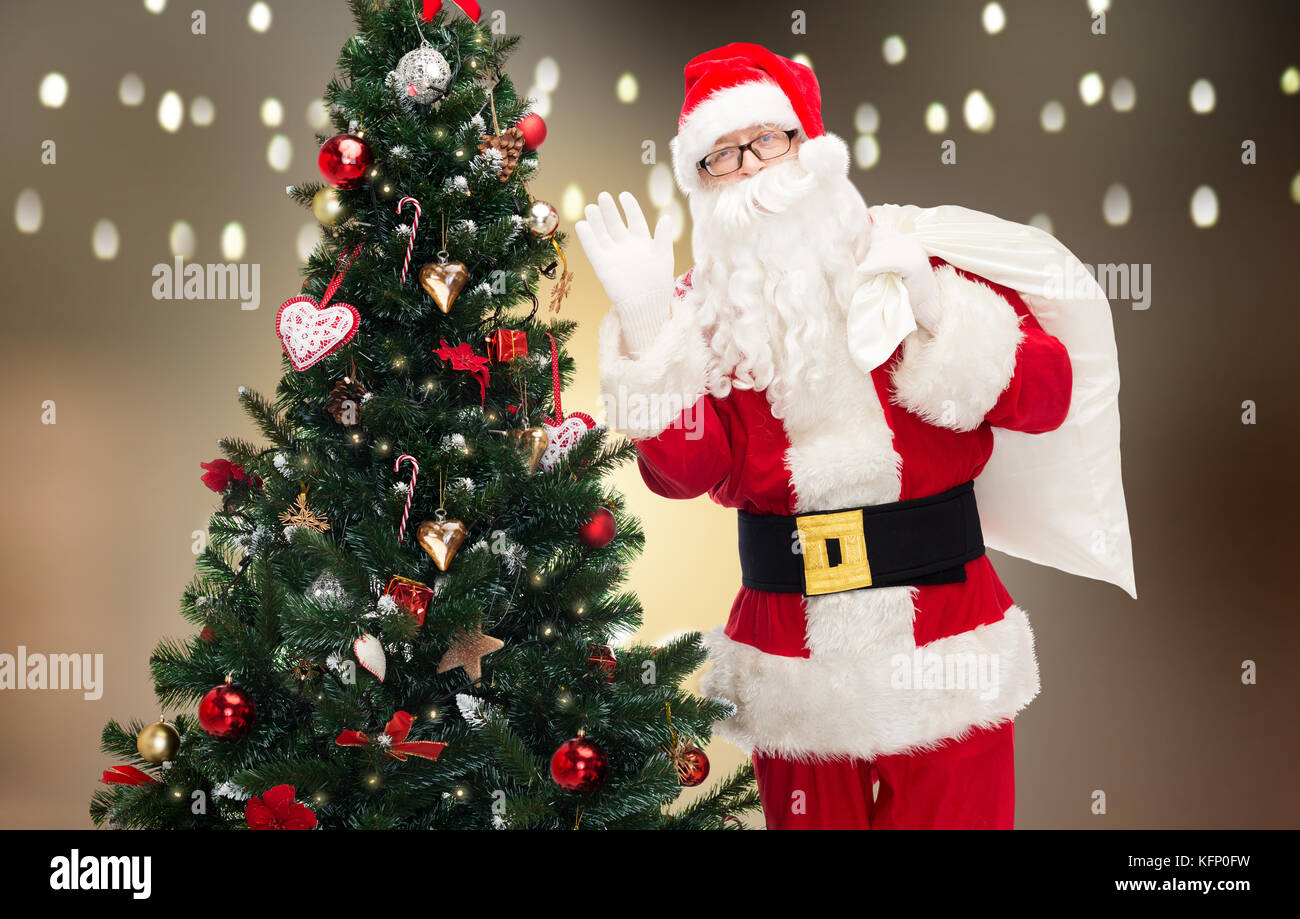 Santa claus christmas tree gift hi-res stock photography and images - Alamy