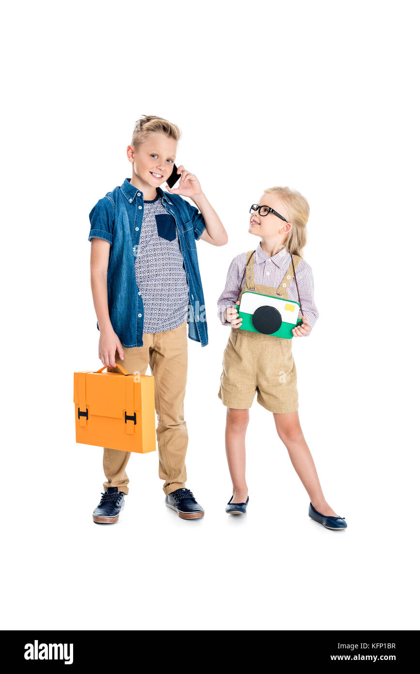 kids with camera, briefcase and smartphone Stock Photo
