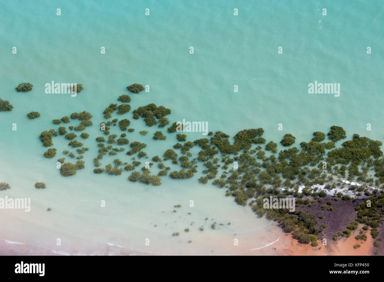 .Aerial view of Broome, North Western Australia as the plane descends for landing on a  hot afternoon in the Wet Season with the mangroves below. Stock Photo