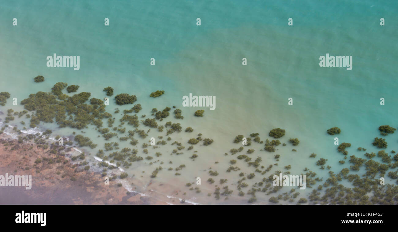 .Aerial view of Broome, North Western Australia as the plane descends for landing on a  hot afternoon in the Wet Season with the mangroves below. Stock Photo