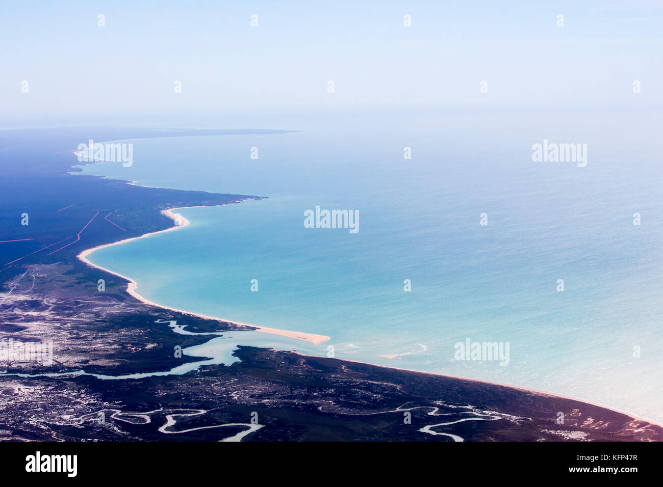 Aerial view of the tidal flat inlets south of Broome, North Western Australia as the plane descends for landing on a hot afternoon in the Summer Wet. Stock Photo