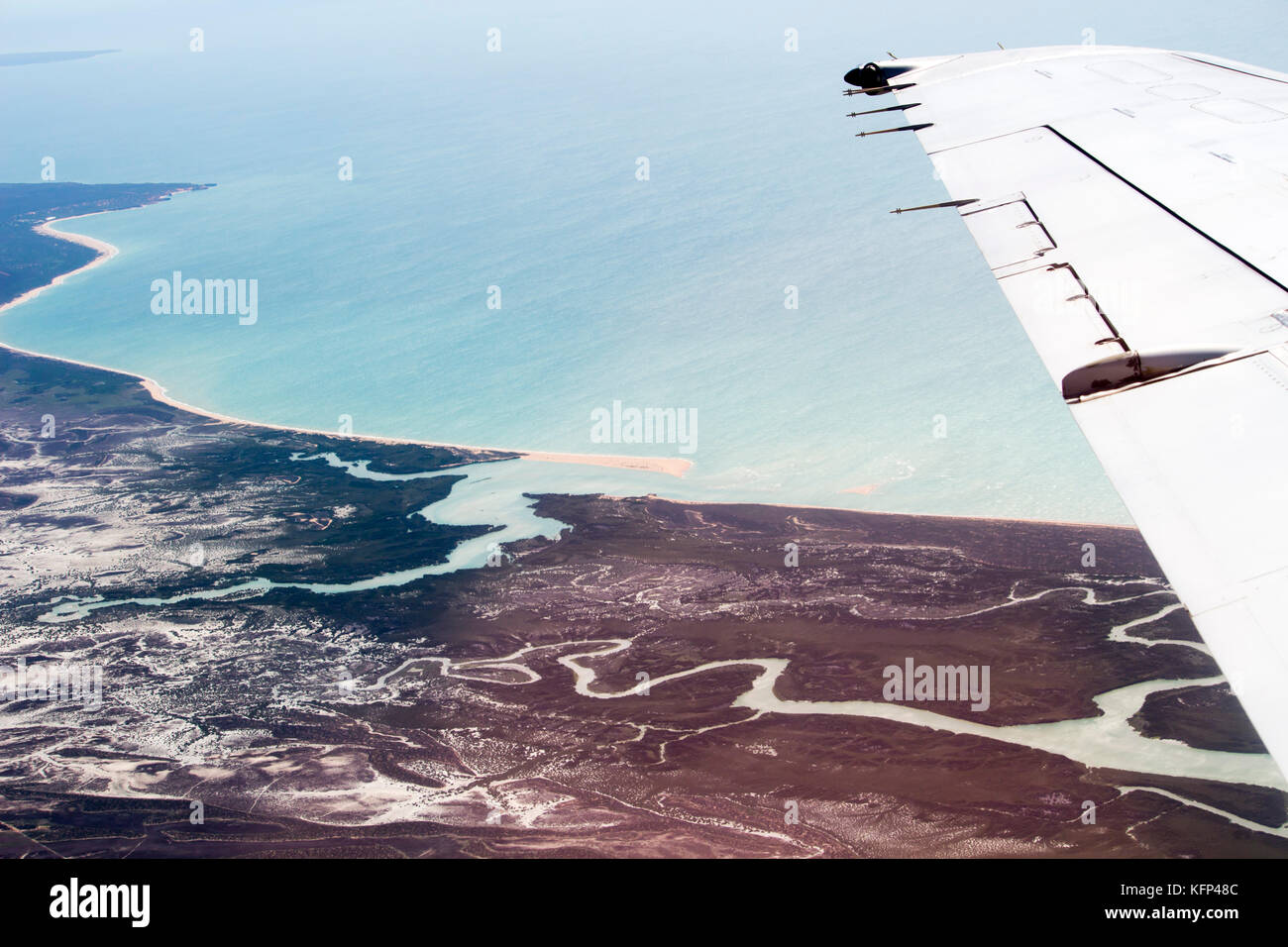 Aerial view of the tidal flat inlets south of Broome, North Western Australia as the plane descends for landing on a hot afternoon in the Summer Wet. Stock Photo