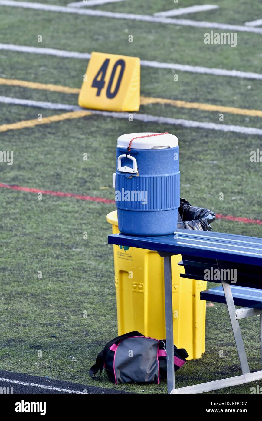 Water cooler on bench at football game Stock Photo - Alamy