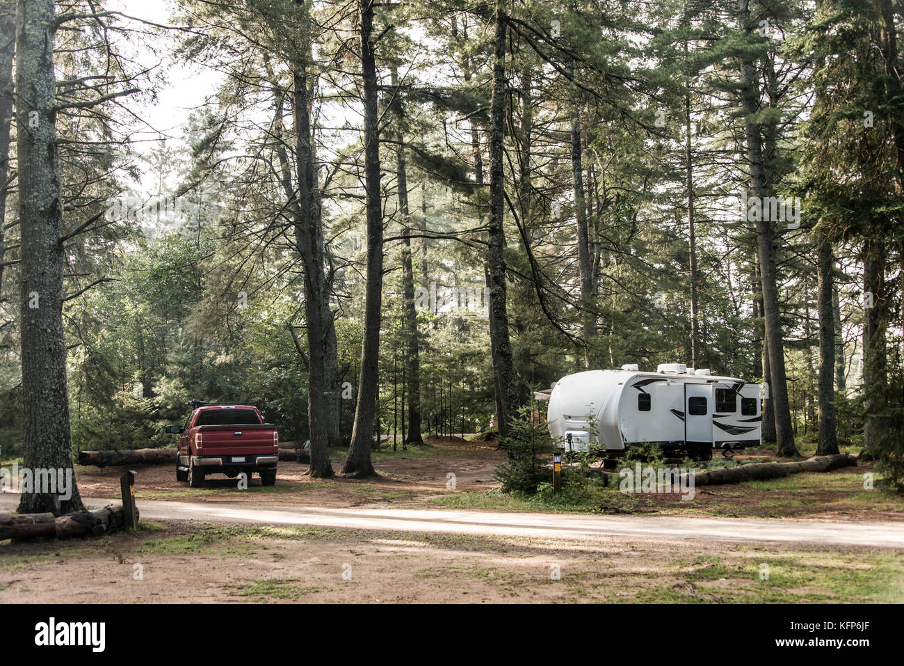 Lake of two rivers Campground Algonquin National Park a Beautiful natural forest landscape Canada Parked RV camper car Stock Photo