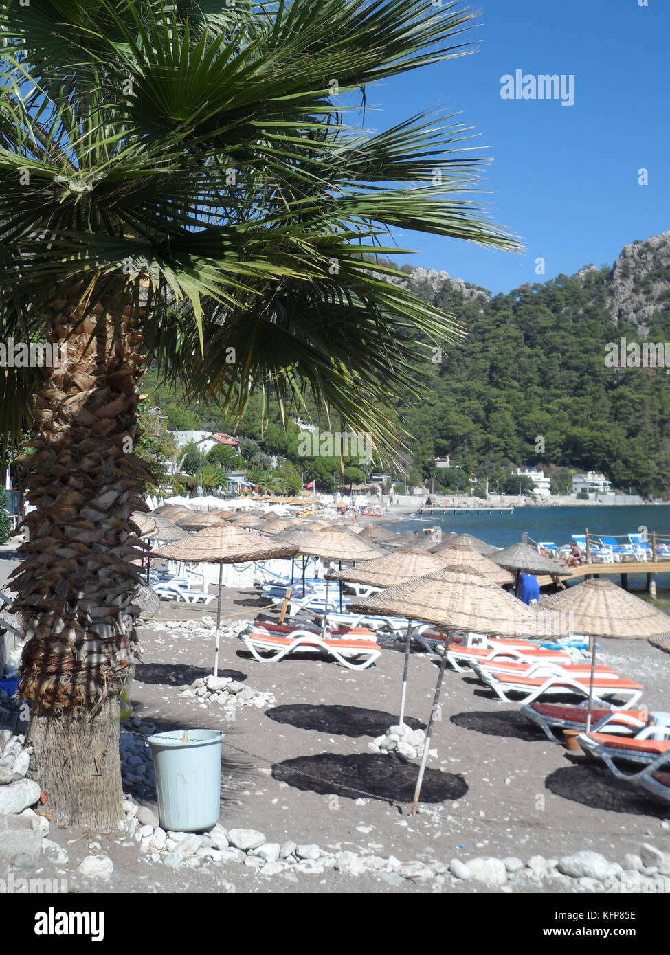Public beach at the coastal village of Turunc, Turkey, Europe Stock Photo
