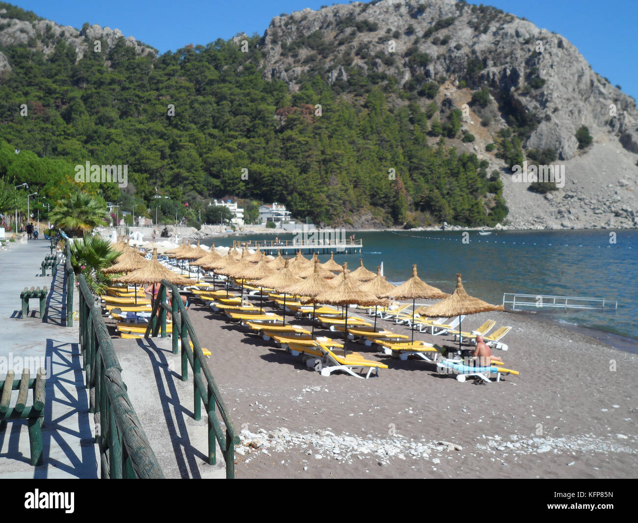 Public beach at the coastal village of Turunc, Turkey, Europe Stock Photo