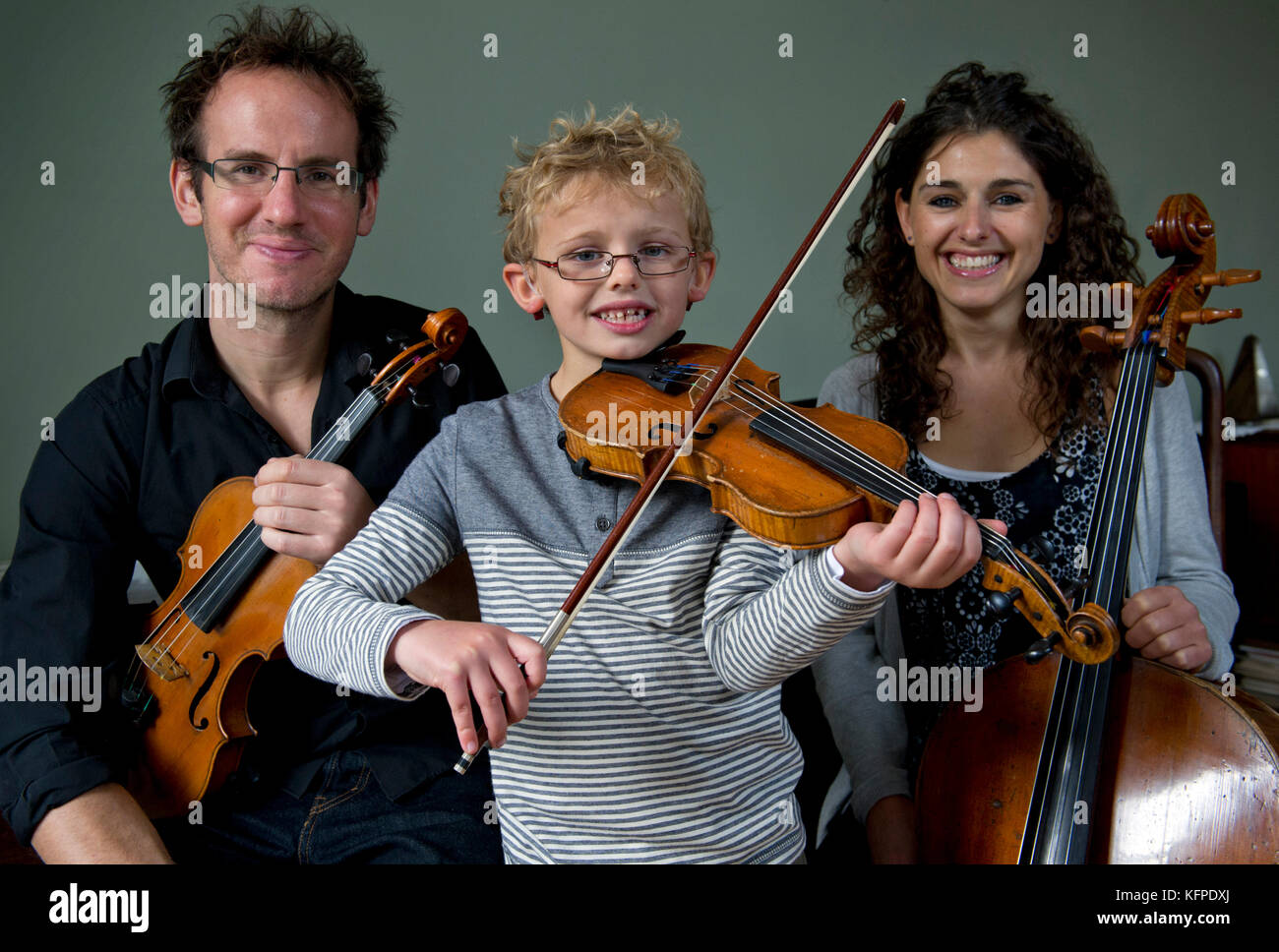 Musical family, Matt & Emma Denton with son Charlie and daughter Daisy. Matt & Emma are part of the Carducc Quartet. Stock Photo