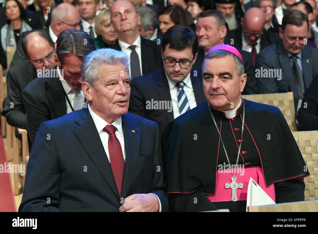 Wittenberg, Germany. 31st Oct, 2017. Former German president Joachim Gauck (L) and Nikola Eterovic, titular archbishop of the Roman Catholic Church and diplomat of the Holy See, at an event to mark the 500th anniversary of the beginning of the Reformation, at the Stadthaus in Wittenberg, Germany, 31 October 2017. Martin Luther is said to have posted his 95 theses on the door of the Schlosskirche in Wittenberg on 31 October 1517. Credit: Hendrik Schmidt/dpa-Zentralbild/dpa/Alamy Live News Stock Photo