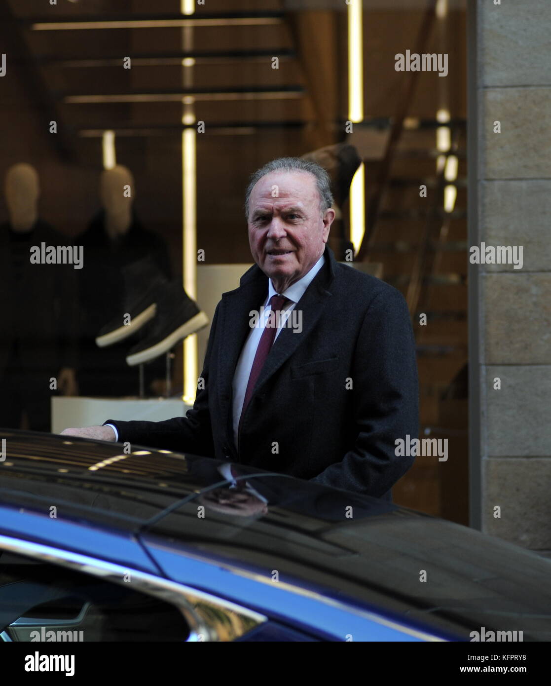 Milan, Ennio Doris shopping downtown with driver Ennio Doris, president