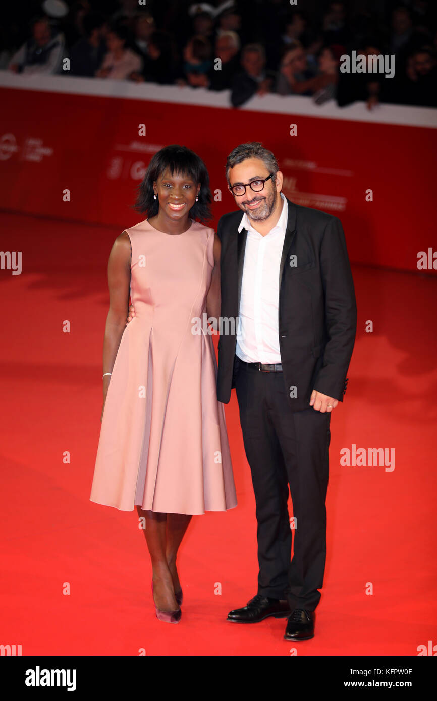 Rome, Italy. 30th Oct, 2017. Rome Cinema Fest 2017. Pictured: Eric Toledano, director and French actress Eye Haidara on the red carpet of the Rome Film Festival 'C'est la vie!'. Credit: Polifoto / Alamy Live News Stock Photo