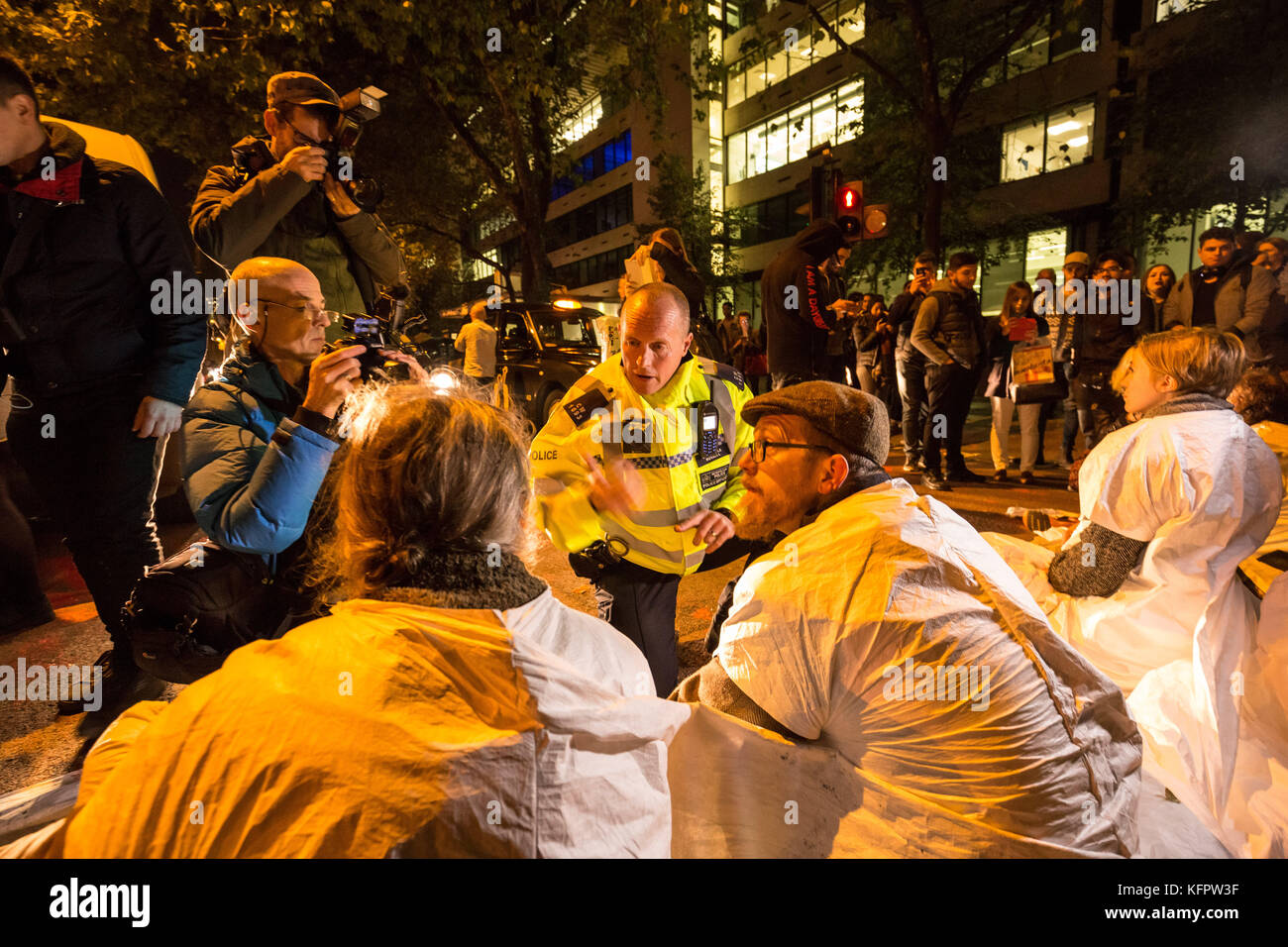 London, UK. 31st Oct, 2017. ‘Stop Killing Londoners’ environmental campaign activists perform a direct action road block in Baker Street during evening rush hour to demand urgent attention to prevent premature deaths from increasing city air pollution. Credit: Guy Corbishley/Alamy Live News Stock Photo