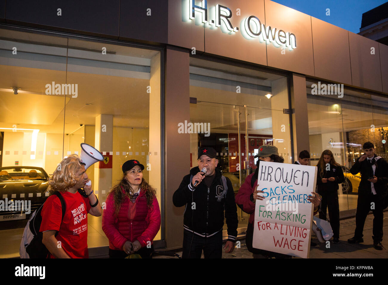 London, UK. 31st Oct, 2017. Fredy Lopez addresses supporters outside luxury car dealer H.R. Owen's Ferrari showroom in South Kensington. He and Angelica Valencia Bolanos, suspended without pay by contractor Templewood Cleaning for having joined trade union United Voices of the World and for having voted to strike for the London Living Wage, are the only cleaners responsible for cleaning H.R. Owen's Ferrari showroom via contractor Templewood Cleaning. Credit: Mark Kerrison/Alamy Live News Stock Photo