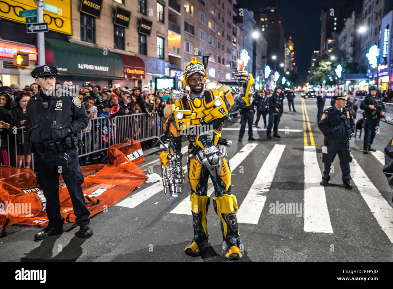New York, USA. 31st Oct, 2017. A reveler wears costume as he takes a photo in front of police during Greenwich Village Halloween Parade. Security was reinforced earlier today after a terrorist attack in downtown New York. Credit: Enrique Shore/Alamy Live News Stock Photo