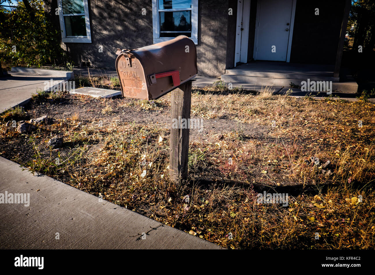 Worn out mailbox on a deserted place in Arizona US Stock Photo