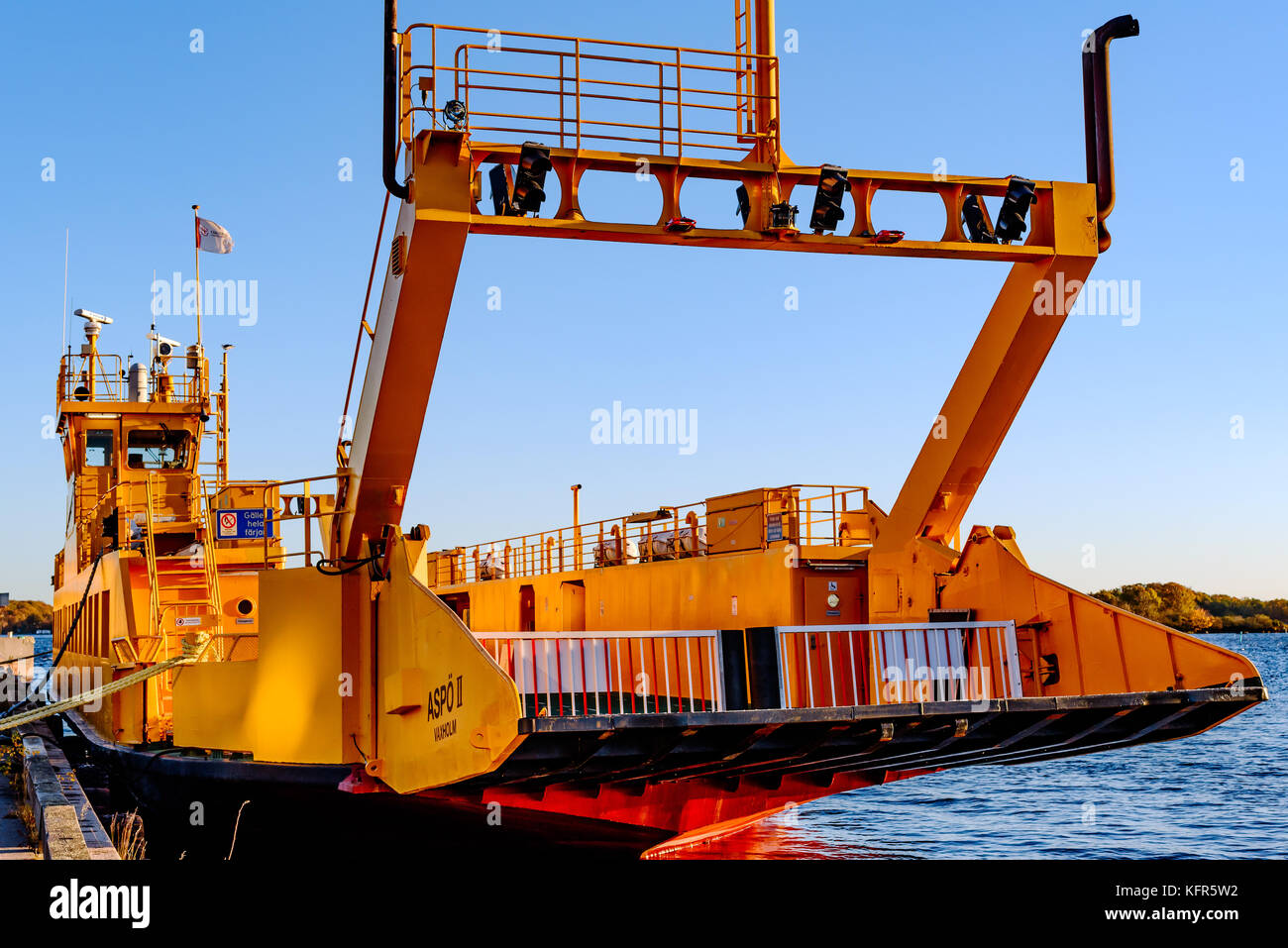 Karlskrona, Sweden - October 30, 2017: Environmental documentary. Empty yellow commuter ferry moored at the harbor. Ship seen from the front with car  Stock Photo