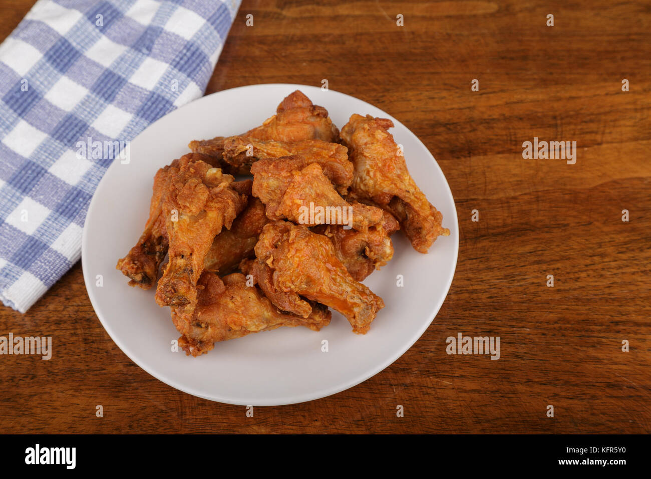 Buffalo Wings on White Plate and Wood Table Stock Photo Alamy