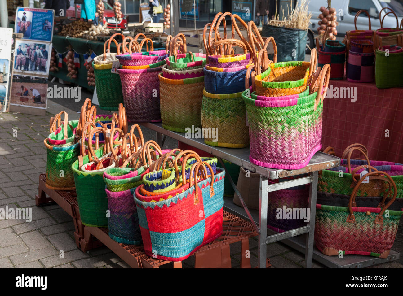 Coloured baskets on a market stall in a French Market in the UK Stock Photo
