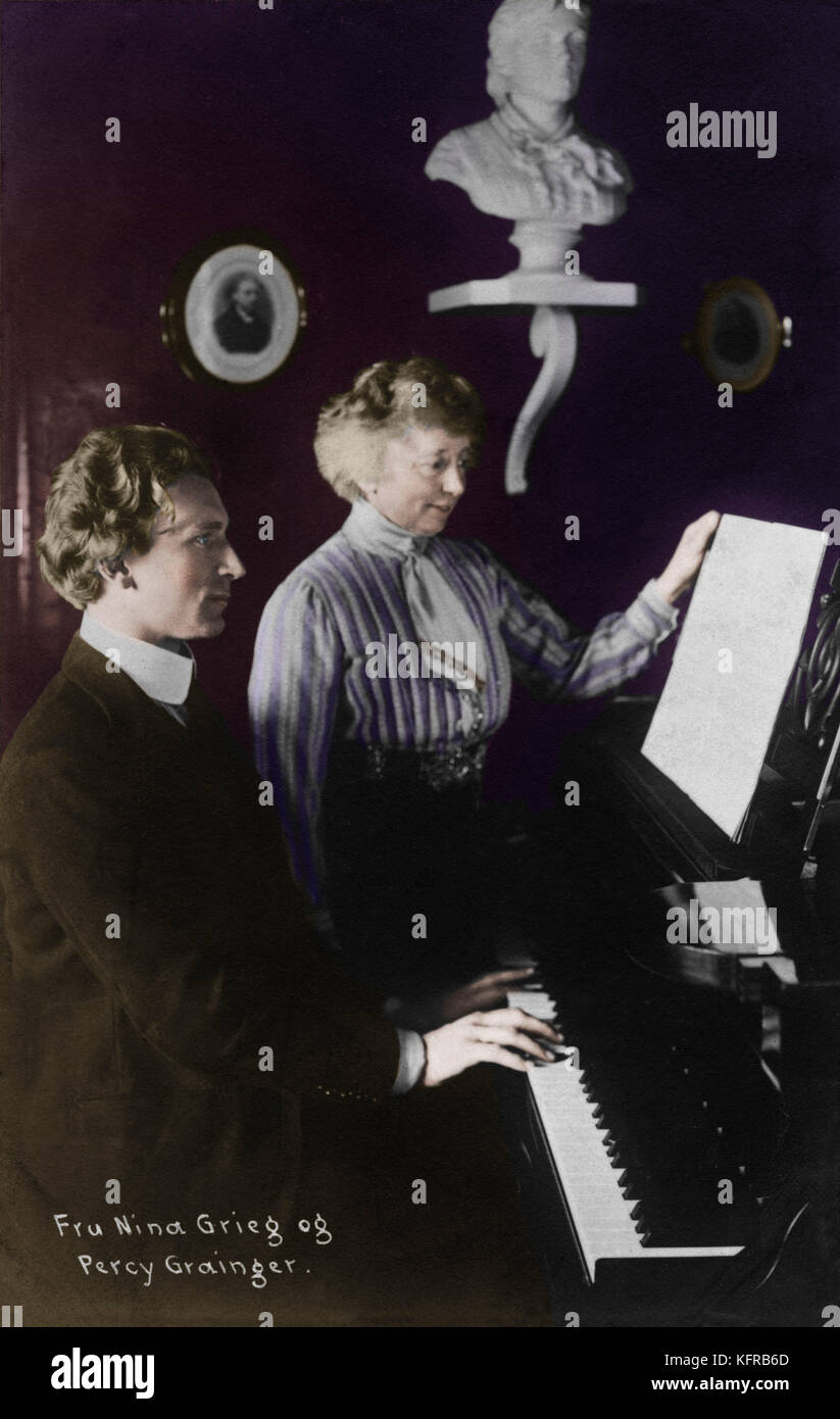 Percy Grainger playing the piano with Nina Grieg looking at the score. Australian-American pianist 8 July 1882- 20 February 1961.  Grainger was a close friend and admirer of Edward Grieg and his wife. Stock Photo