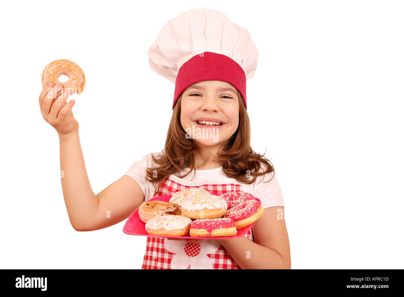 happy little girl cook with sweet donuts Stock Photo