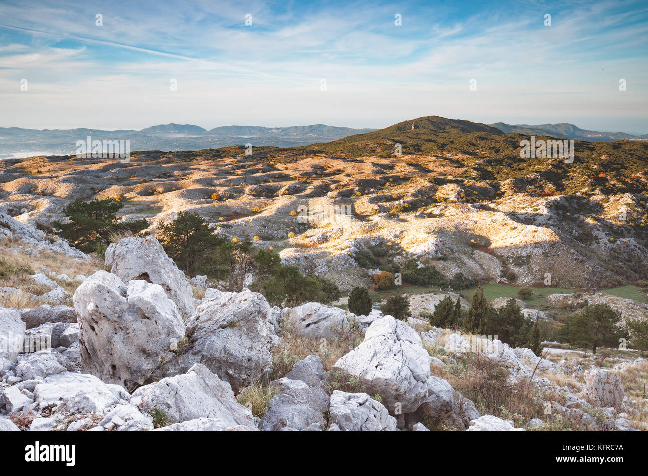 After sunrise - the scenic view down from the highest mount (Pantocrator) on the Ionian Island Corfu, Greece. White rocks, beautiful  autumn colors Stock Photo