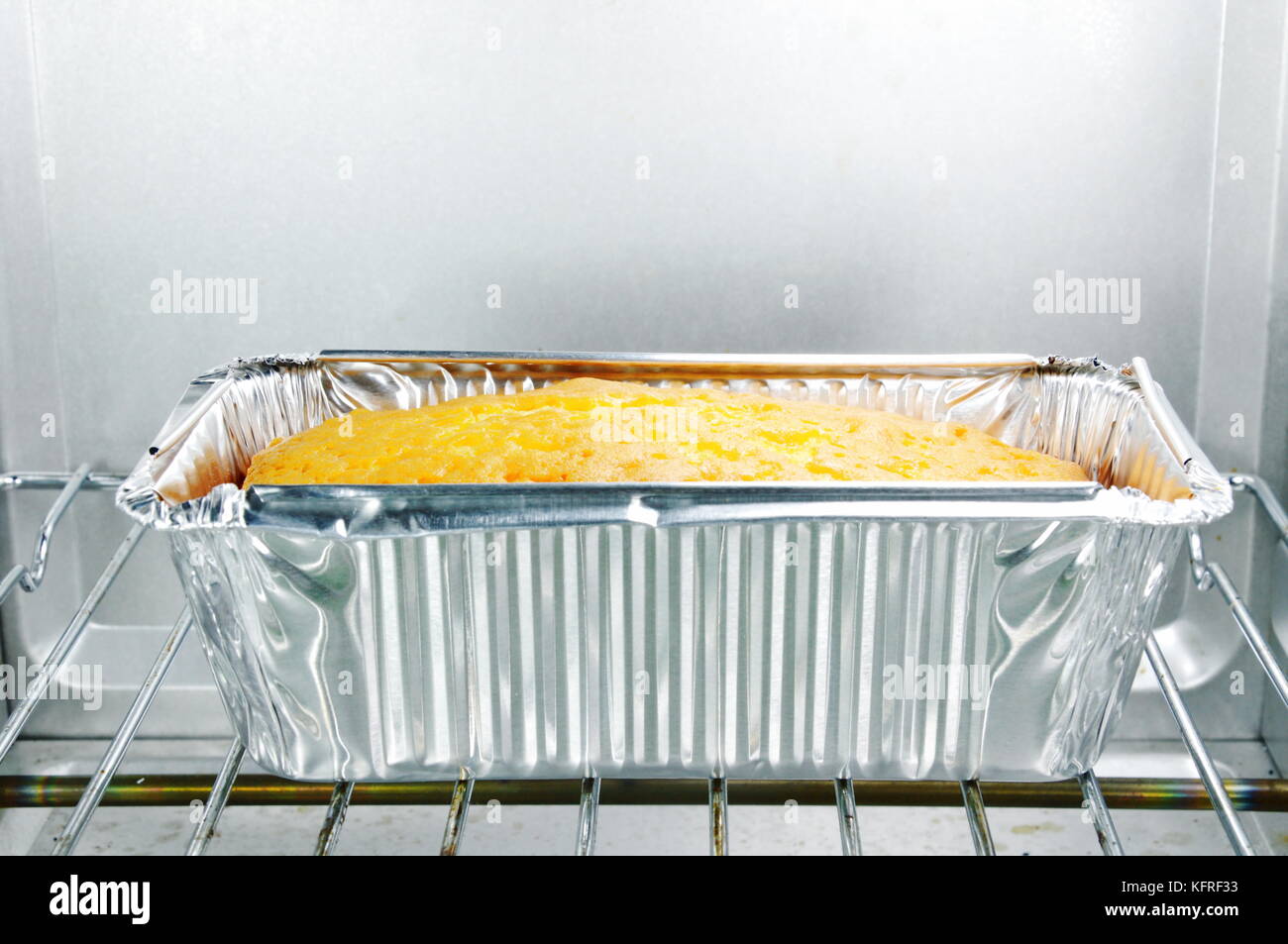 sponge butter cake in electric oven Stock Photo Alamy