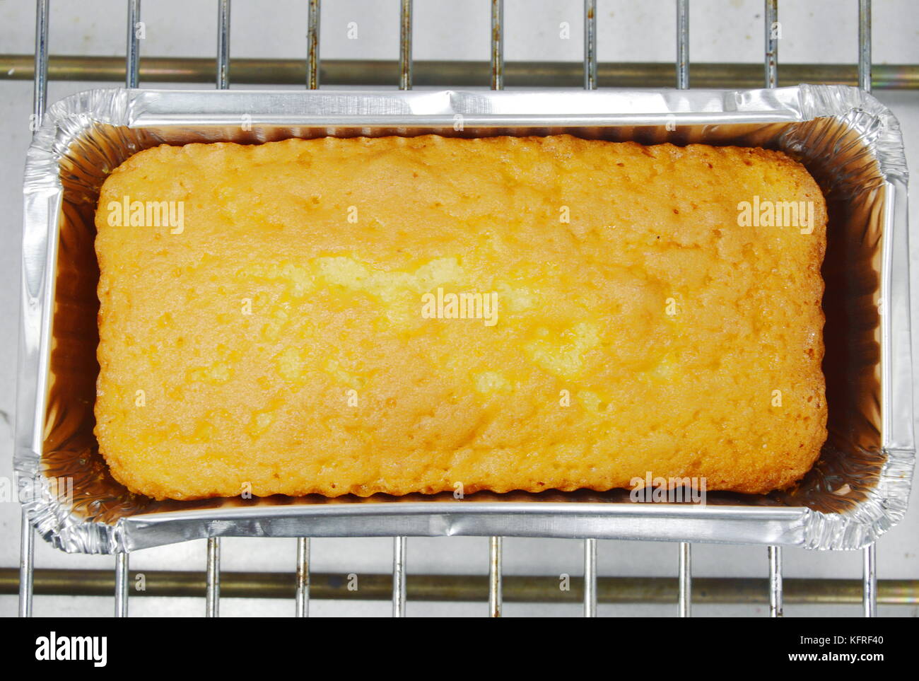 sponge butter cake in electric oven Stock Photo Alamy