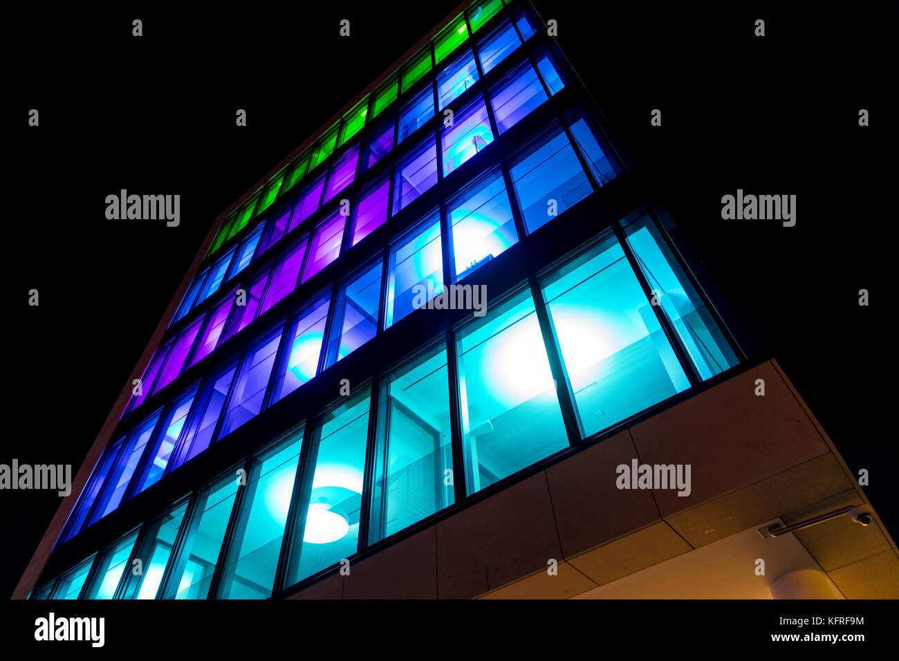 Illuminated facade of the Allbau headquarter building, Essen, Germany, during Essen Light Festival, Stock Photo