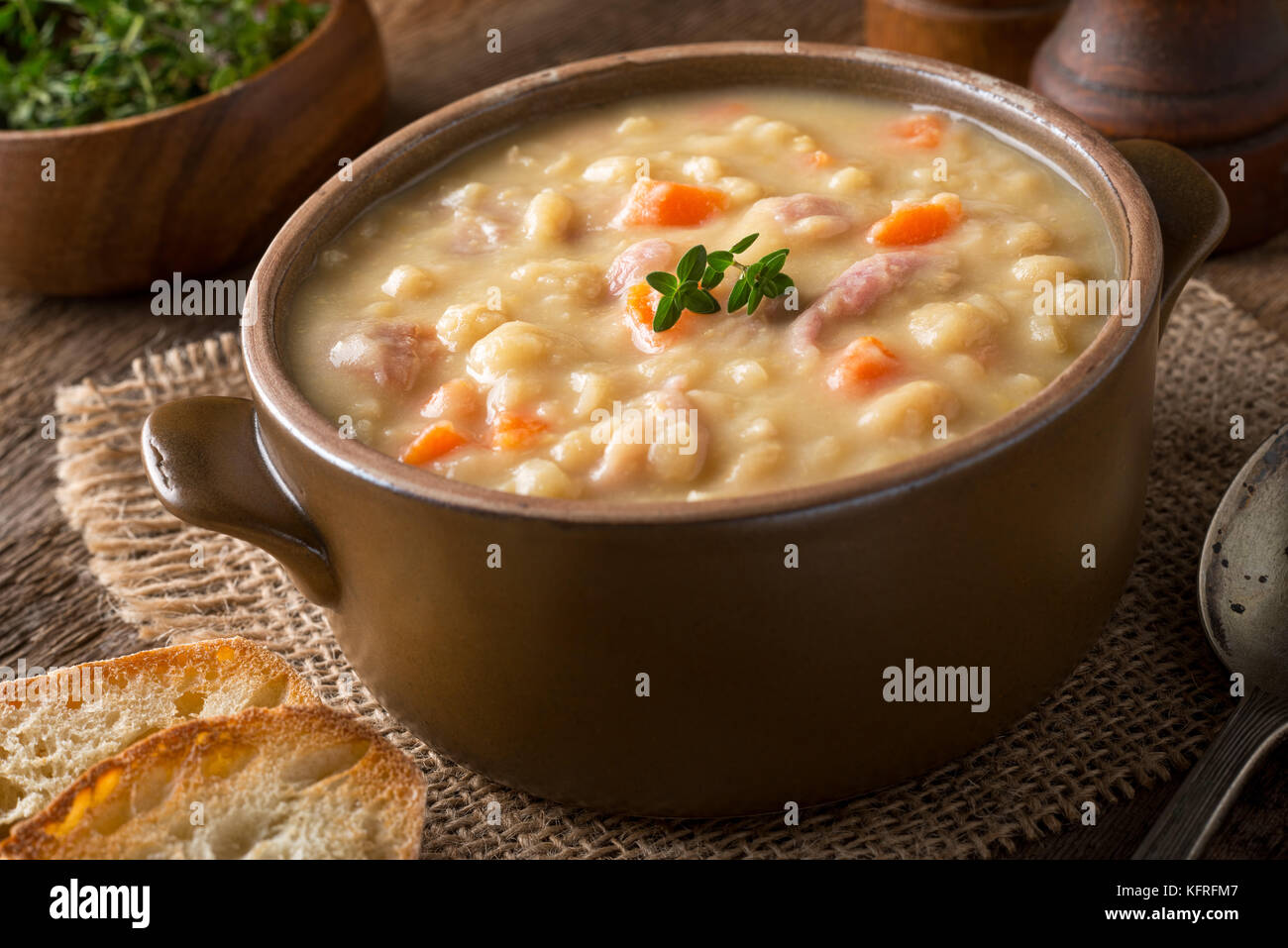 A bowl of delicious hearty yellow split pea soup. Stock Photo