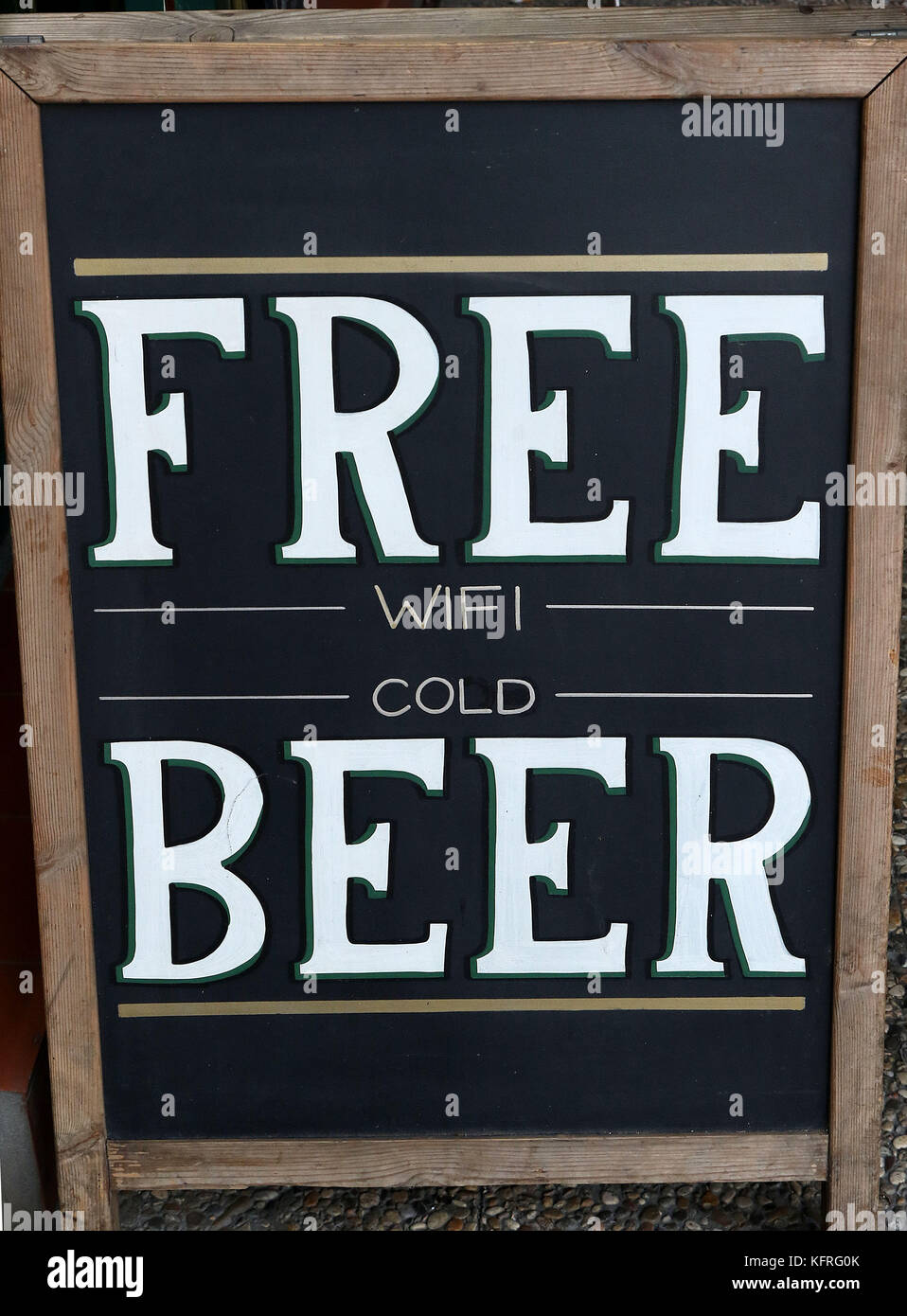 A sign outside pub offering FREE wifi and cold BEER at Gibraltar Stock Photo