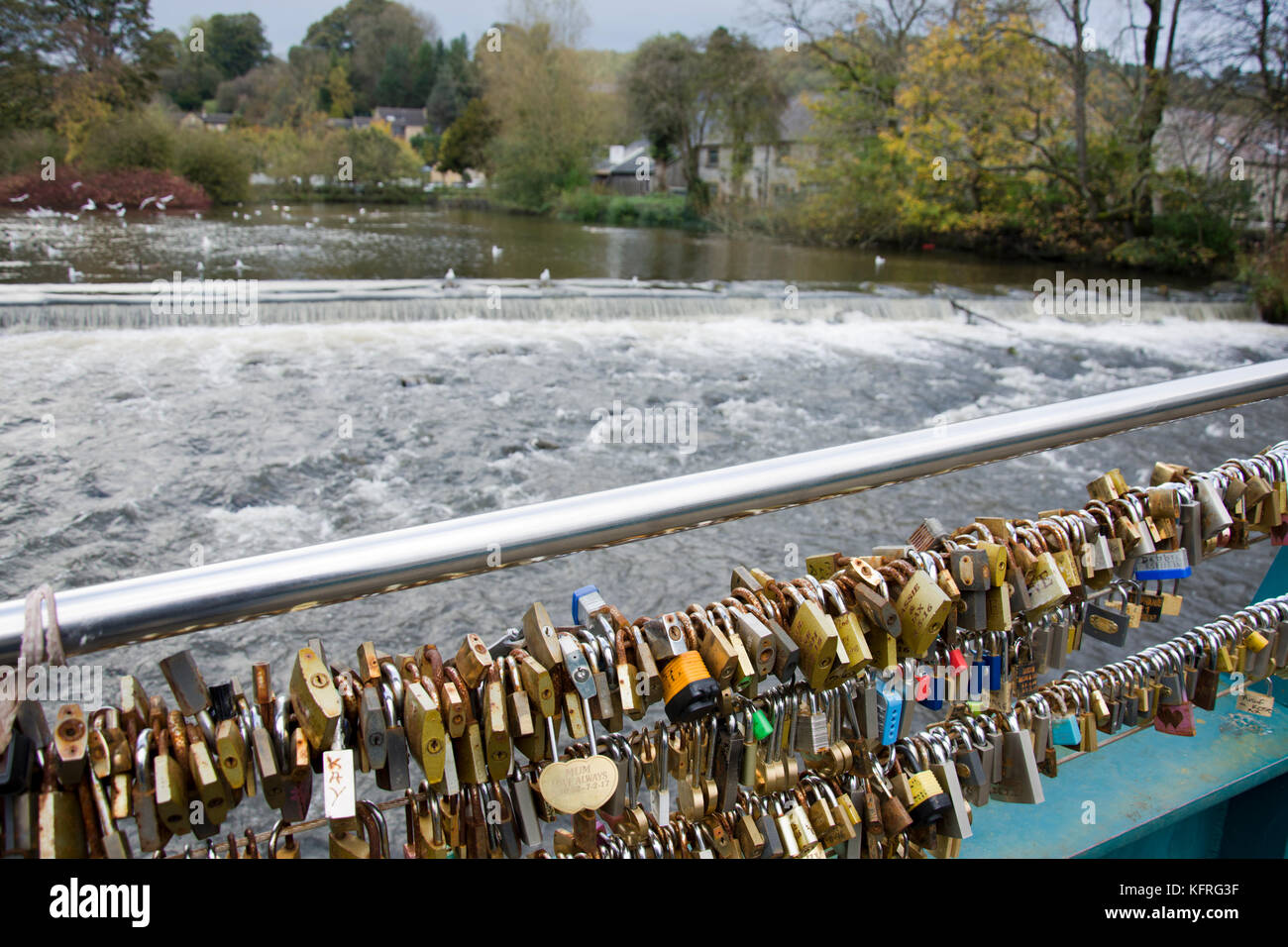 Love locks attached to Weir bridge, over the river Wye, Bakewell