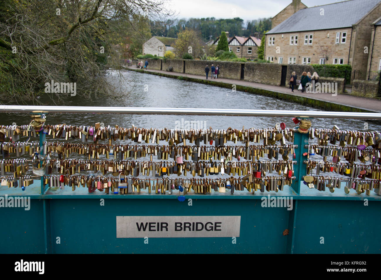 Love locks attached to Weir bridge, over the river Wye, Bakewell