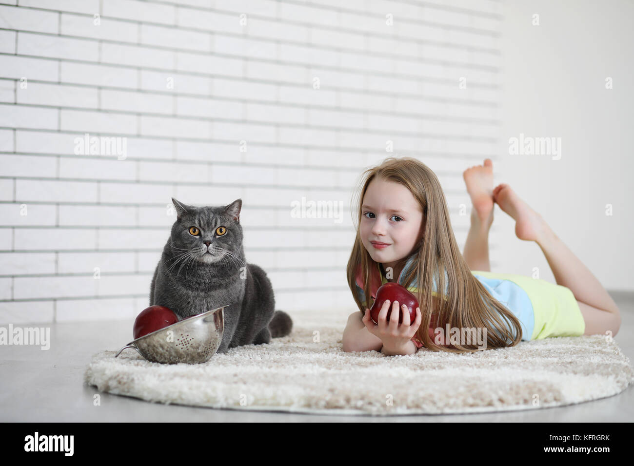 little girl lies on the floor Stock Photo - Alamy