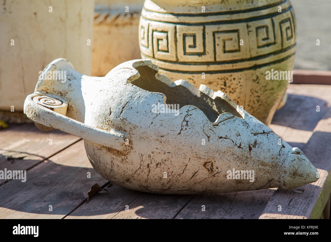 old clay jugs on a wooden table close-up Stock Photo