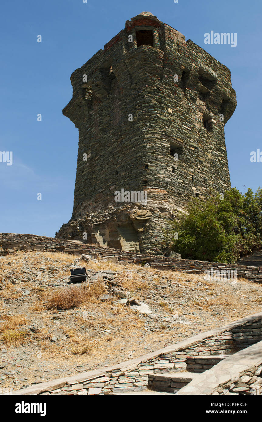 Corsica: the Tower of Nonza, Genoese tower (16th century) on the sheer cliffs atop 100 metres to the sea below in Nonza, village of western Cap Corse Stock Photo