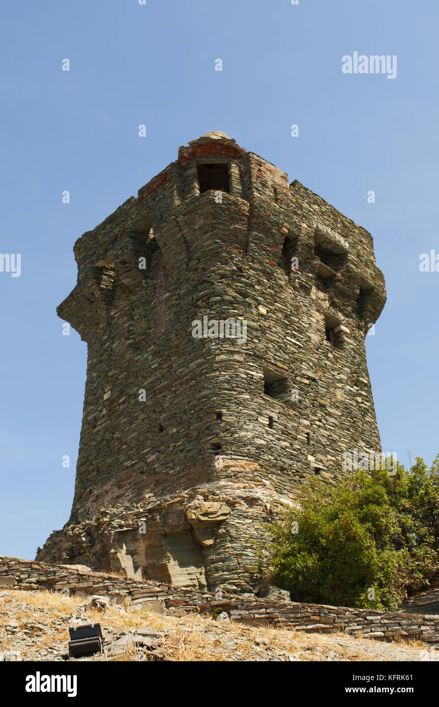 Corsica: the Tower of Nonza, Genoese tower (16th century) on the sheer cliffs atop 100 metres to the sea below in Nonza, village of western Cap Corse Stock Photo