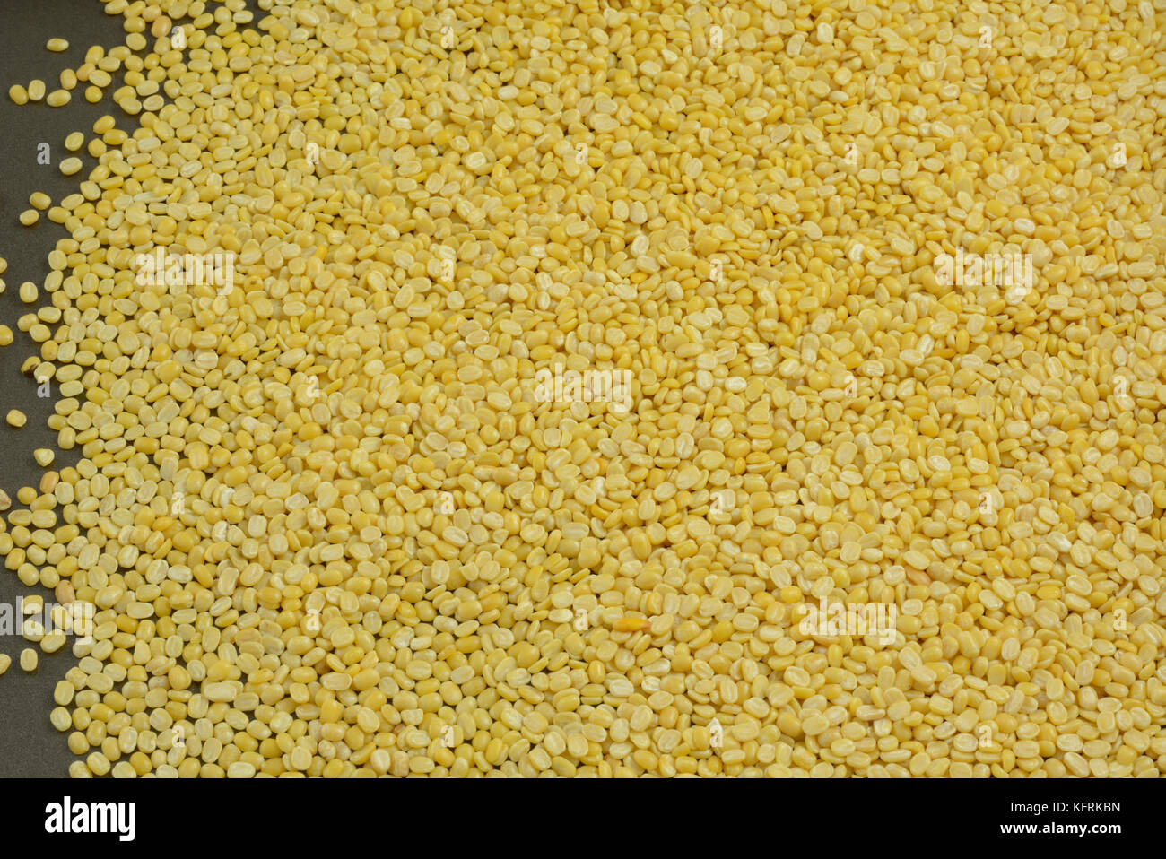 Close up of Moong dal or split yellow mung beans Stock Photo