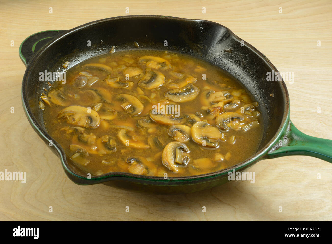 Mushroom sauce gravy in cast iron frying pan skillet Stock Photo Alamy