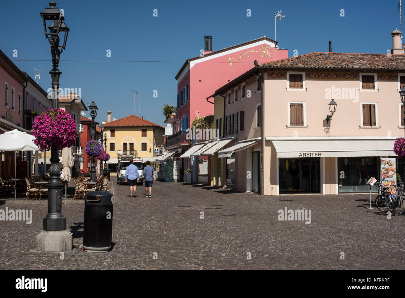 Shops and bars on Rio Terra, Caorle, Veneto Stock Photo - Alamy