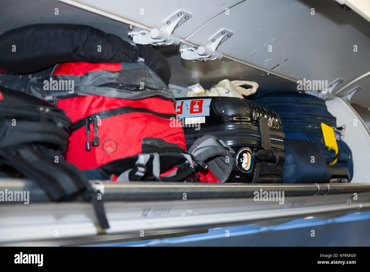Passengers airplane overhead lockers hires stock photography and