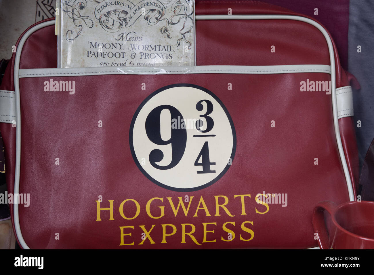 Moony wormtail padfoot and prongs book with a 9 3/4 hogwarts express satchel Stock Photo