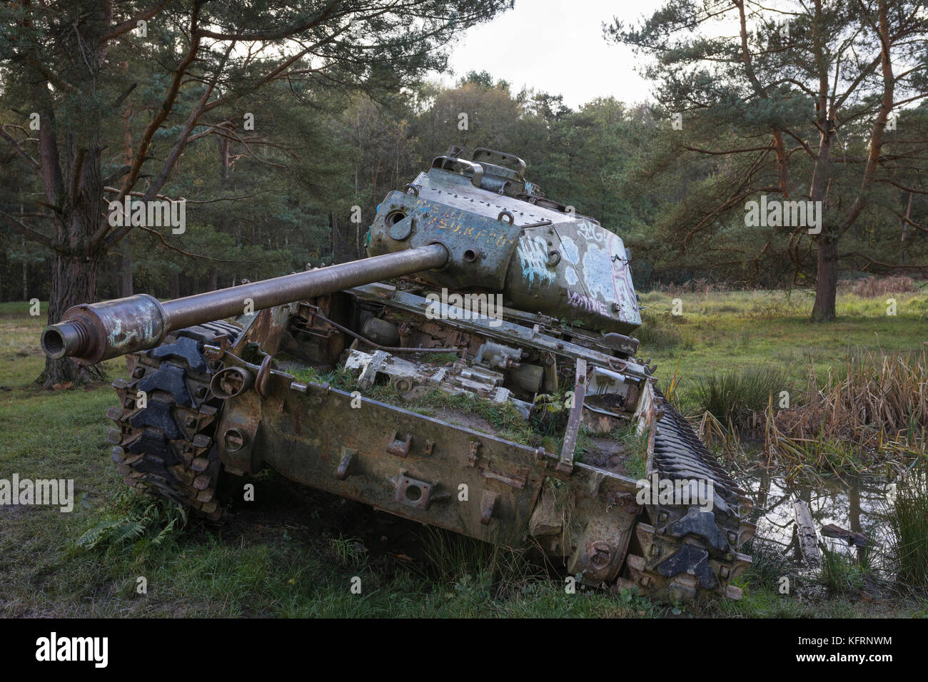 Dumped historical M47 Patton tank left behind in forest Stock Photo