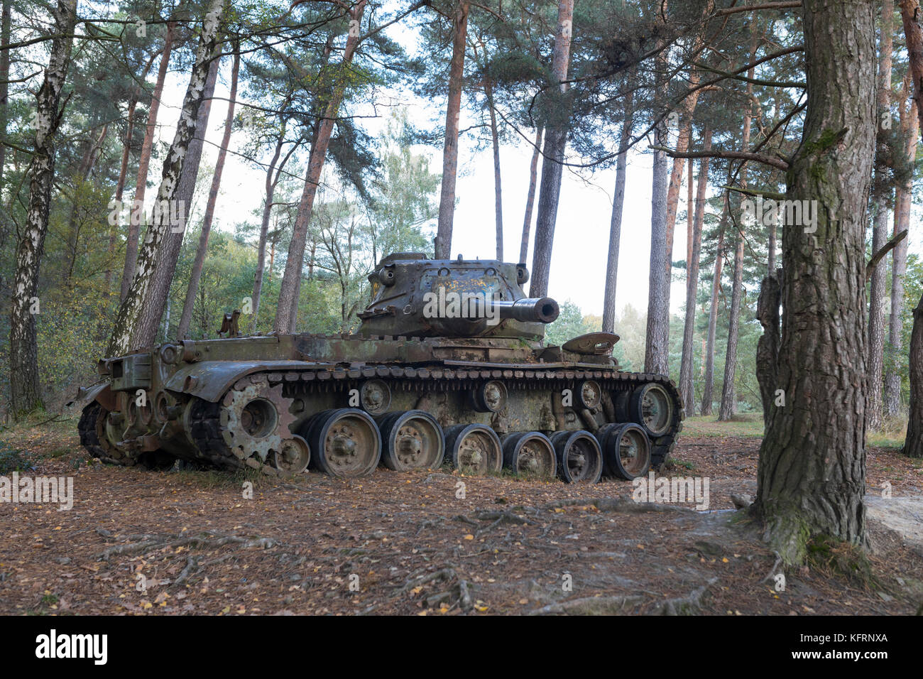 Dumped historical M41 Walker Bulldog tank left behind in forest Stock Photo